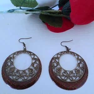 Circular copper looking filigree burgundy earrings